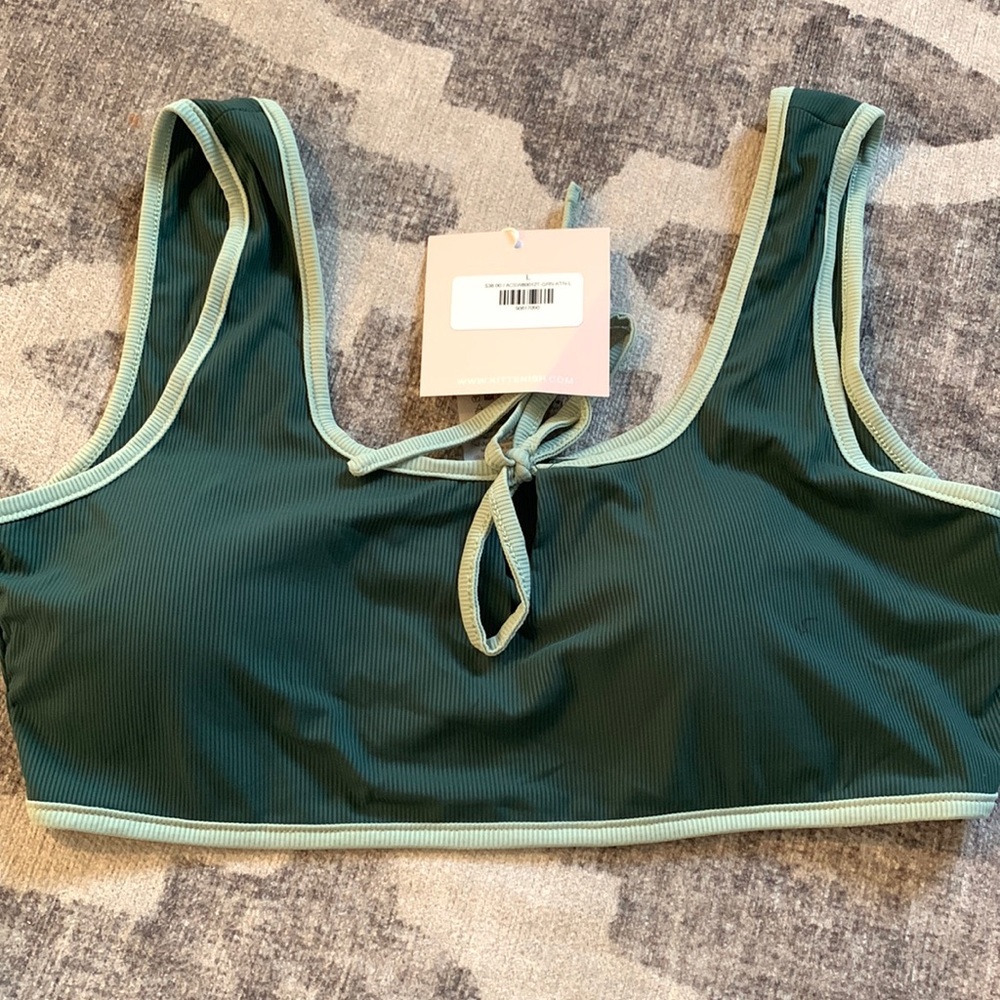 Brand new kittenish swim top with tags size L Very stretchy